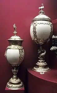 Two tall covered cups of ostrich eggs with mounts in silver-gilt