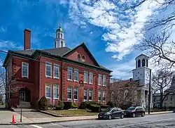 (L–R) Walley School (1896), First Baptist Church (1814), and Bristol County Statehouse/Courthouse (1816) on the town common