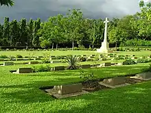 Image 53Chittagong War Cemetery is a Commonwealth War Graves Commission cemetery located at Dampara 22 kilometers north of the airport and 8 kilometers from the port. The burial area is surrounded by a large plantation. A tarmac lane leads from the entrance gate to the burial area which is entered through a metal gate flanked by two small brick chapels.Photo Credit: Hossain Toufique Iftekher