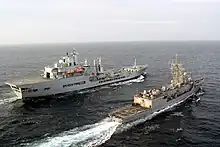 Wave Ruler (background) refuels USS Robert G. Bradley in the Pacific Ocean.