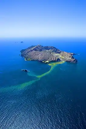 Photograph of Whakaari/White Island, with Te Paepae o Aotea visible behind