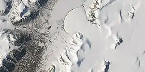 Romer Lake's Elephant Foot Glacier in the Earth's Arctic, as seen by Landsat 8.  This picture shows several glaciers that have the same shape as many features on Mars that are believed to also be glaciers.