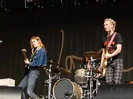 A band performs for a live audience.