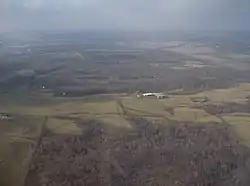 Woods and hills northeast of Zanesfield