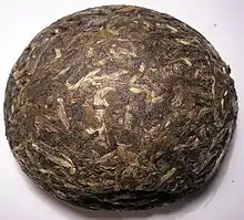 Green Pu-erh tuo cha, a type of compressed raw pu-erh