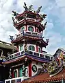 A decorated tower on the side of the temple