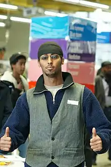 Somali man wearing waistcoat, tuque and polar fleece