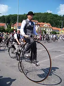 The rider astride the bicycle