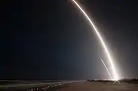 Long exposure of the launch and landing of the first stage of the Falcon 9