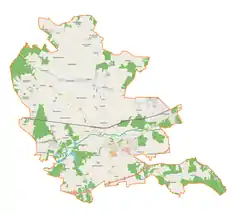 Mapa konturowa gminy Łask, u góry nieco na lewo znajduje się punkt z opisem „Parafia św. Anny we Wrzeszczewicach”