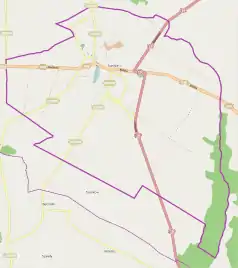 Mapa konturowa Łosic, u góry znajduje się punkt z opisem „Parafia Trójcy Świętej”