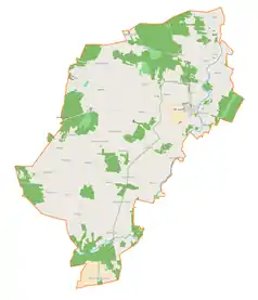 Mapa konturowa gminy Burzenin, blisko centrum na dole znajduje się punkt z opisem „Kolonia Niechmirów”