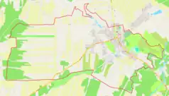 Mapa konturowa Głowaczowa, blisko centrum na prawo u góry znajduje się punkt z opisem „miejsce bitwy”