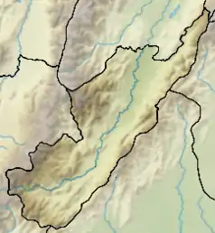 Mapa konturowa Huila, po lewej nieco u góry znajduje się czarny trójkącik z opisem „Nevado del Huila”