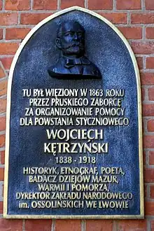 Tablica upamiętniająca więzienie W. Kętrzyńskiego w Bramie Górnej w Olsztynie w 1863