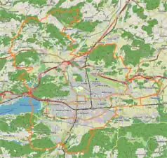 Mapa konturowa Klagenfurtu am Wörthersee, po lewej nieco na dole znajduje się punkt z opisem „Universität Klagenfurt”