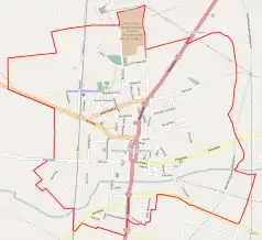 Mapa konturowa Koźmina Wielkopolskiego, w centrum znajduje się punkt z opisem „Kościół Świętego Stanisława w Koźminie Wielkopolskim”