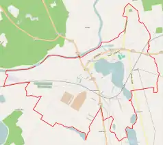 Mapa konturowa Międzychodu, po prawej znajduje się owalna plamka nieco zaostrzona i wystająca na lewo w swoim dolnym rogu z opisem „Jezioro Miejskie”