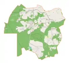 Mapa konturowa gminy Olsztyn, u góry po prawej znajduje się ikonka pałacu z opisem „Dwór w Bukownie”