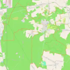 Mapa konturowa Olsztyna, po prawej nieco na dole znajduje się czarny trójkącik z opisem „Biakło”