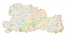 Mapa konturowa powiatu łęczyckiego, po prawej znajduje się punkt z opisem „Janów”