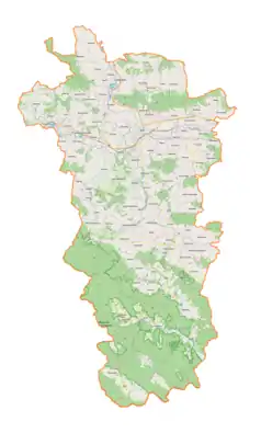 Mapa konturowa powiatu jasielskiego, po prawej znajduje się punkt z opisem „Nienaszów”