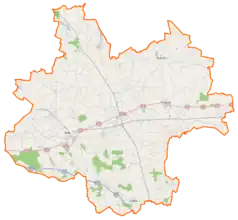 Mapa konturowa powiatu kolskiego, blisko centrum na lewo u góry znajduje się punkt z opisem „Kaczyniec”