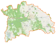 Mapa konturowa powiatu nowotomyskiego, na dole po lewej znajduje się punkt z opisem „Zamek w Zbąszyniu”