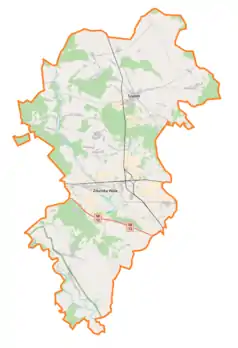 Mapa konturowa powiatu zduńskowolskiego, w centrum znajduje się punkt z opisem „Biały Ług”