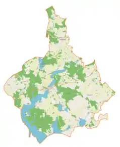 Mapa konturowa gminy Ryn, na dole znajduje się punkt z opisem „Ławki”