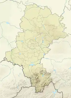 Mapa konturowa województwa śląskiego, po prawej nieco u góry znajduje się czarny trójkącik z opisem „Łysak”