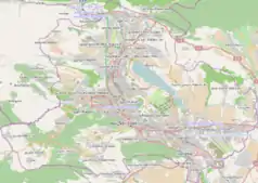 Mapa konturowa Tbilisi, u góry znajduje się punkt z opisem „Stadion Olimpi”