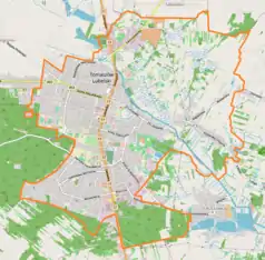 Mapa konturowa Tomaszowa Lubelskiego, po lewej znajduje się punkt z opisem „Muzeum Regionalne w Tomaszowie Lubelskim”