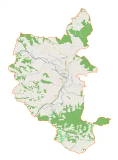 Mapa konturowa gminy Tuchów, po lewej nieco u góry znajduje się punkt z opisem „Cmentarz wojenny nr 170 – Łowczów”