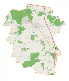 Mapa konturowa gminy Tuszyn, u góry znajduje się punkt z opisem „Tuszyn”