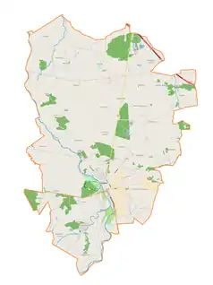 Mapa konturowa gminy Uniejów, blisko centrum na lewo u góry znajduje się punkt z opisem „Skotniki”