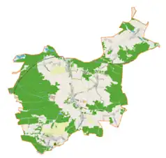 Mapa konturowa gminy Włodowice, blisko centrum na dole znajduje się ikonka pałacu z opisem „Pałac we Włodowicach(ruiny)”