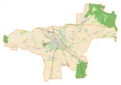 Mapa konturowa gminy Wieluń, blisko centrum u góry znajduje się punkt z opisem „Cukrownia Wieluń S.A.”