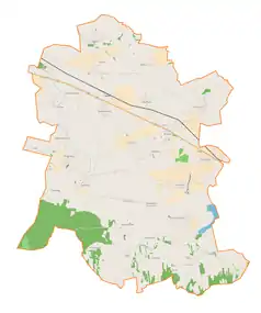 Mapa konturowa gminy Wróblew, blisko centrum na lewo u góry znajduje się punkt z opisem „Słomków Suchy”