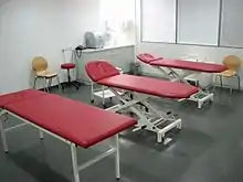 a room with three massage tables