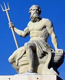 A sculpture of Neptune/Poseidon holding a trident