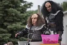 Photograph of two people in Klingon costume